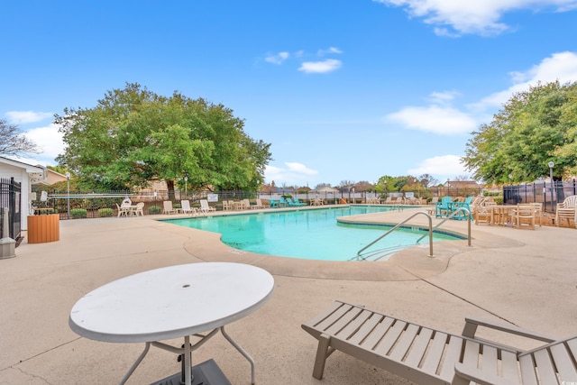 view of swimming pool with a patio area