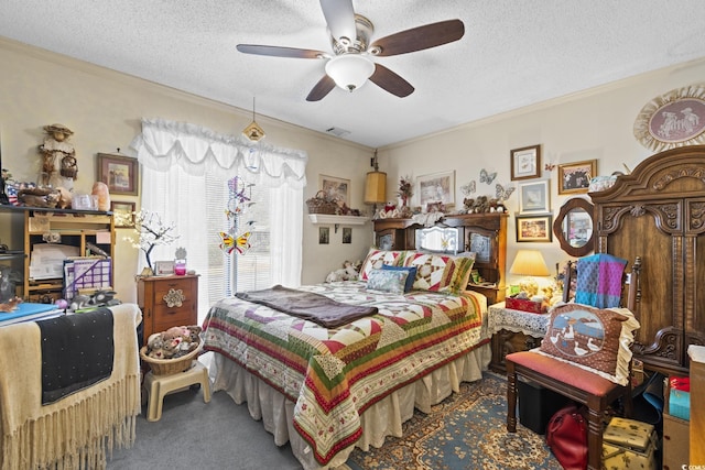 bedroom featuring ceiling fan, crown molding, carpet floors, and a textured ceiling