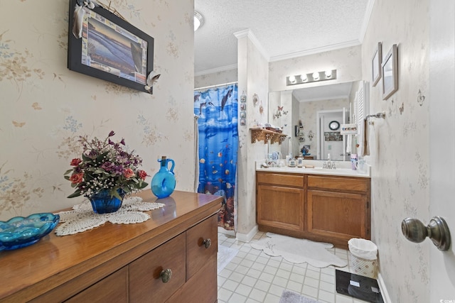 bathroom featuring tile patterned floors, vanity, ornamental molding, and a textured ceiling