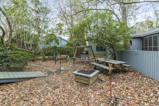 view of yard with an outdoor fire pit