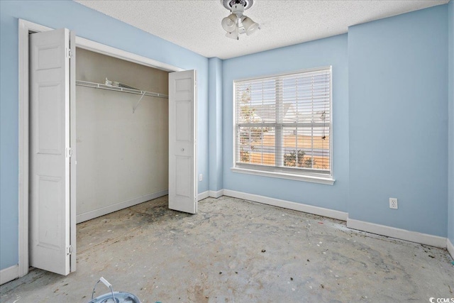 unfurnished bedroom with a closet and a textured ceiling