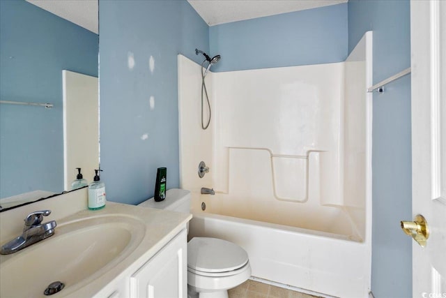 full bathroom with a textured ceiling, washtub / shower combination, vanity, and toilet