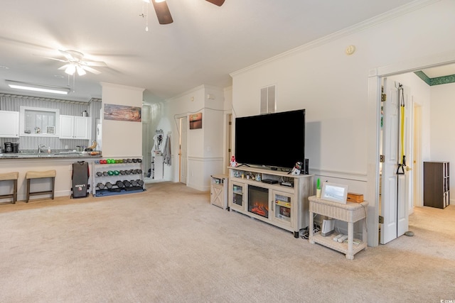 carpeted living room featuring crown molding