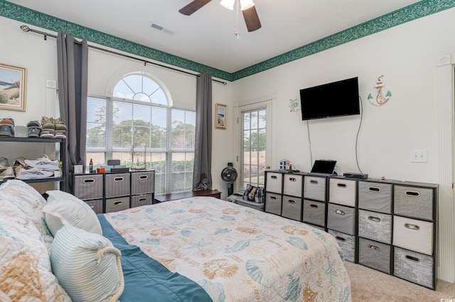 carpeted bedroom with ceiling fan