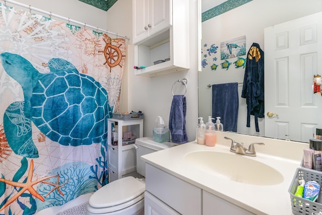 bathroom featuring vanity and toilet