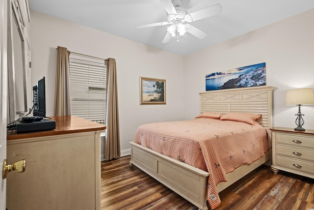 bedroom with ceiling fan and dark hardwood / wood-style flooring