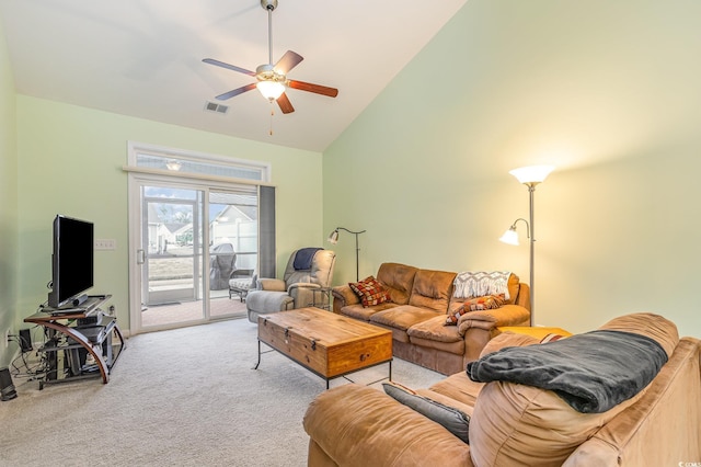 carpeted living area featuring high vaulted ceiling, visible vents, and ceiling fan