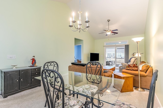 dining room with high vaulted ceiling and ceiling fan with notable chandelier