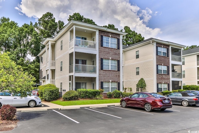 1302 River Oaks Dr Unit 4-F, Myrtle Beach, SC 29579 - view of property featuring uncovered parking