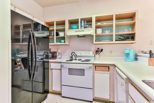 kitchen with white appliances and white cabinets