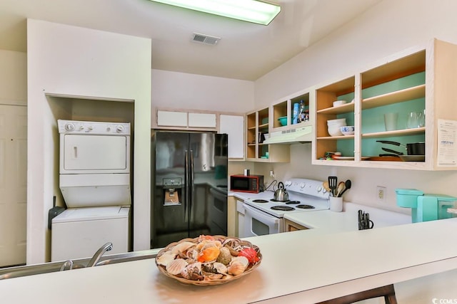 kitchen with white electric stove, white cabinetry, stacked washer and dryer, stove, and black fridge with ice dispenser