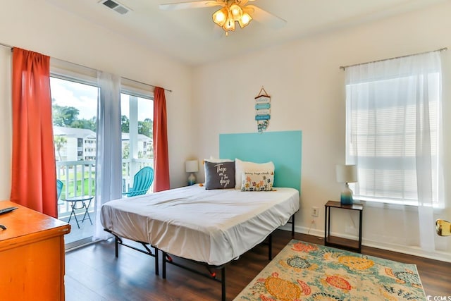 bedroom with ceiling fan, access to exterior, and dark hardwood / wood-style flooring