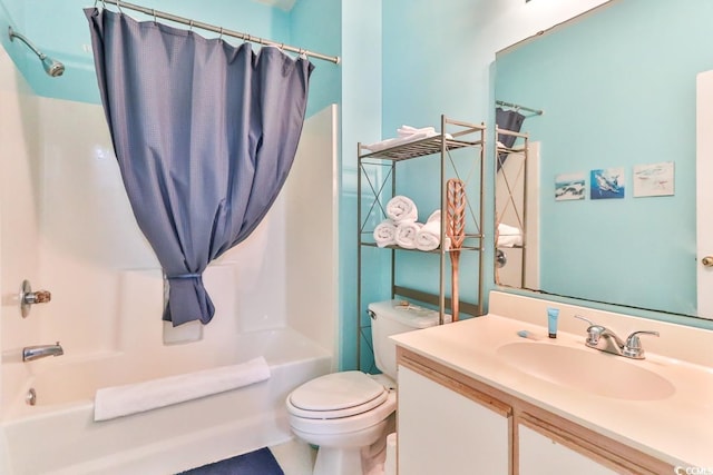 full bathroom featuring shower / tub combo, vanity, and toilet