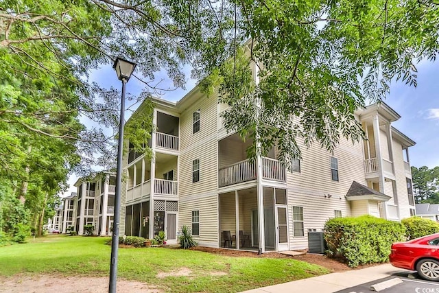 1302 River Oaks Dr Unit 4-F, Myrtle Beach, SC 29579 - view of building exterior featuring uncovered parking