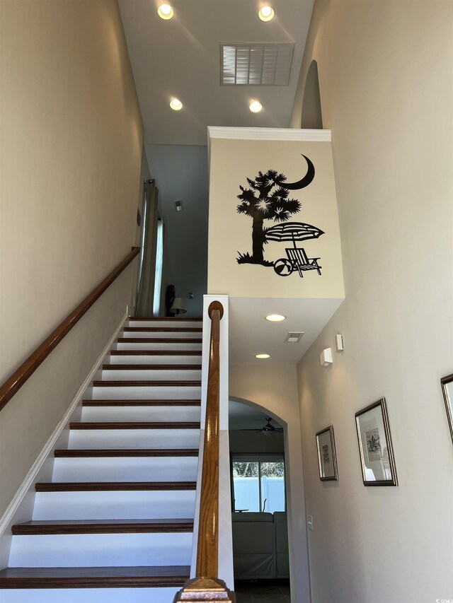 stairway with ceiling fan