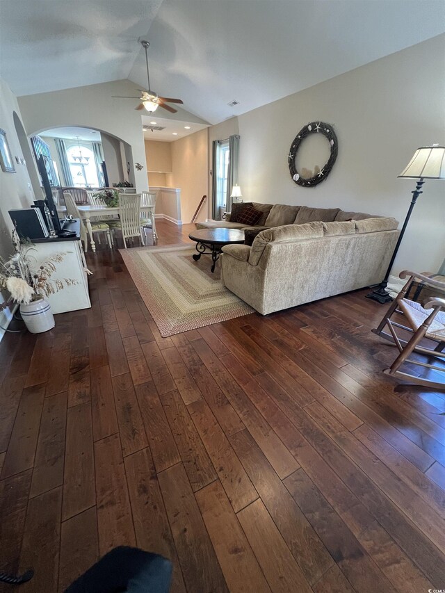 unfurnished living room featuring ceiling fan, dark hardwood / wood-style flooring, and plenty of natural light