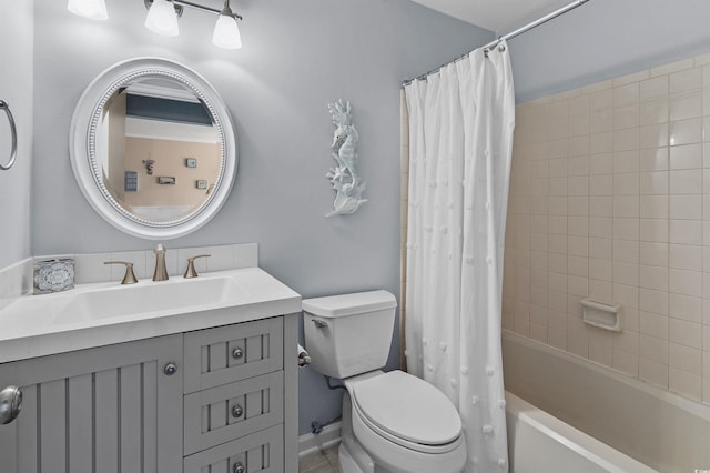 full bathroom with vanity, toilet, and shower / bath combo with shower curtain