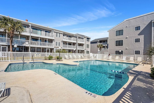 view of swimming pool with a patio