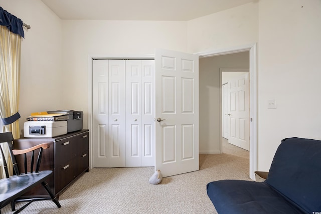 sitting room featuring light colored carpet