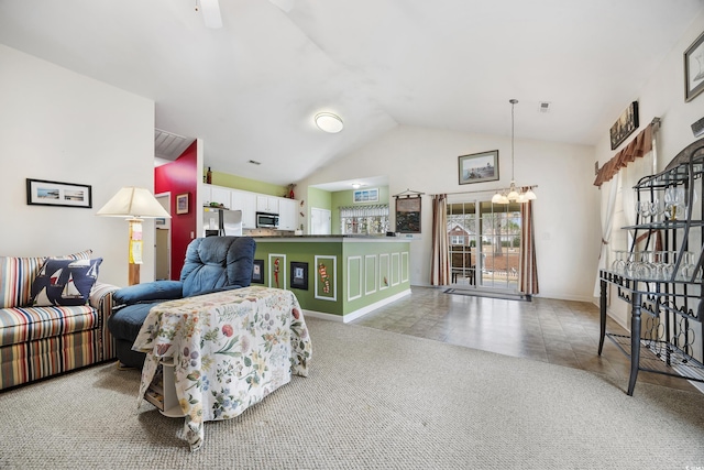 living room featuring vaulted ceiling, light carpet, and a chandelier