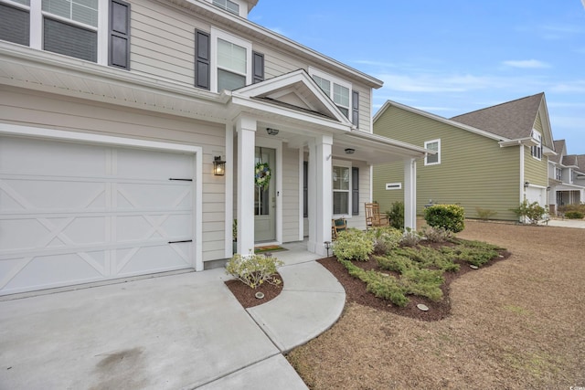 view of front of house with a garage and a porch