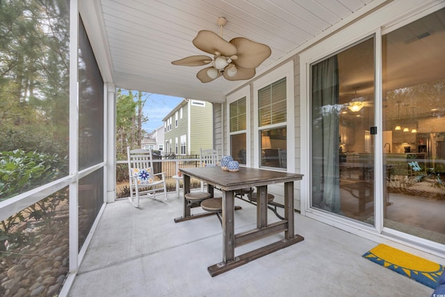 sunroom / solarium with ceiling fan