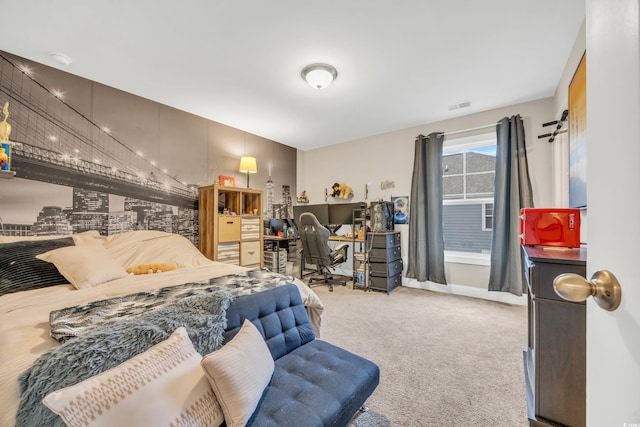 carpeted bedroom featuring visible vents and baseboards