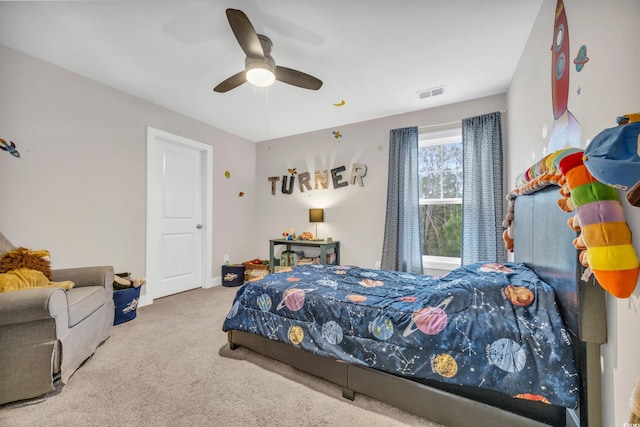 carpeted bedroom with ceiling fan