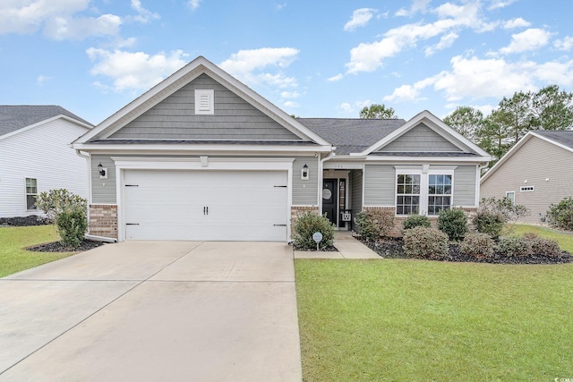 view of front of house with a garage and a front yard