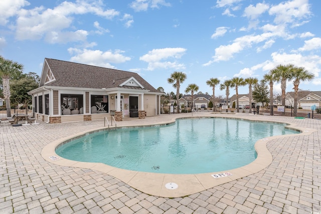 view of swimming pool featuring a patio area