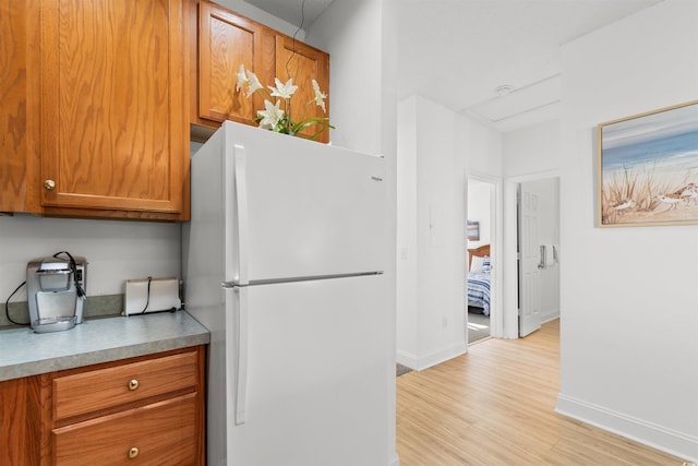 kitchen featuring white fridge and light wood-type flooring