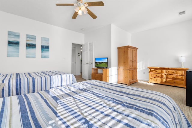 carpeted bedroom with ceiling fan