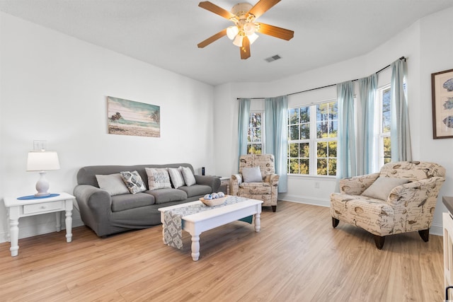 living room featuring ceiling fan and light wood-type flooring