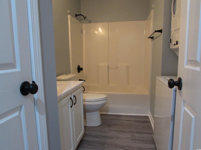 full bathroom featuring washtub / shower combination, vanity, toilet, and hardwood / wood-style floors