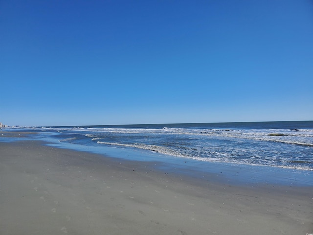 property view of water featuring a beach view