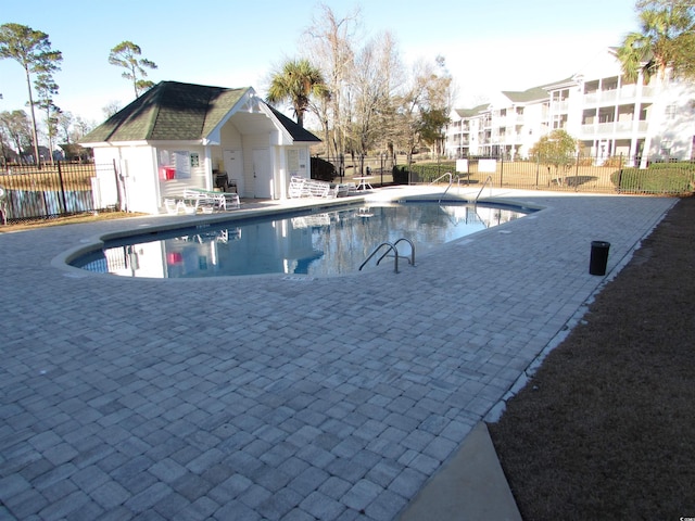 view of swimming pool with a patio