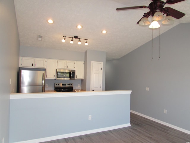 kitchen featuring a textured ceiling, appliances with stainless steel finishes, dark hardwood / wood-style flooring, ceiling fan, and white cabinets