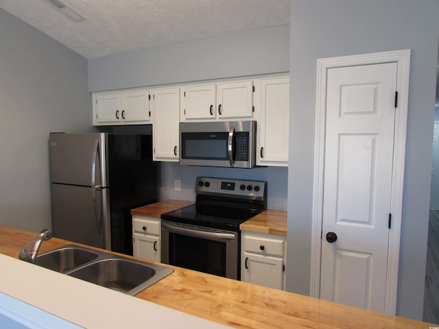 kitchen with white cabinetry and stainless steel appliances