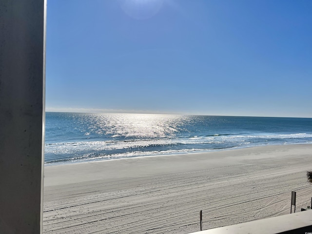 view of water feature with a beach view