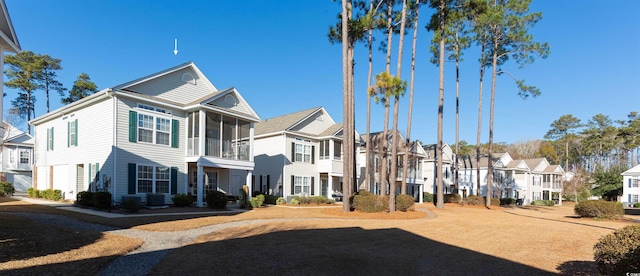 view of front of property with cooling unit and a sunroom