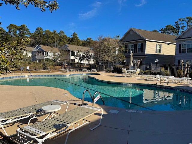 view of pool featuring a patio