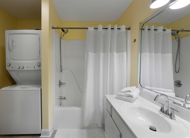 bathroom featuring stacked washer and clothes dryer, vanity, and shower / tub combo with curtain