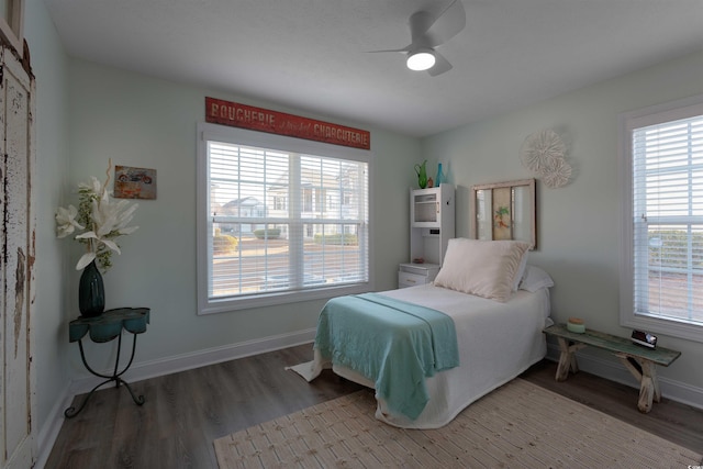 bedroom with ceiling fan and wood-type flooring