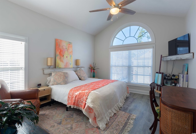 bedroom with ceiling fan, dark hardwood / wood-style flooring, and lofted ceiling