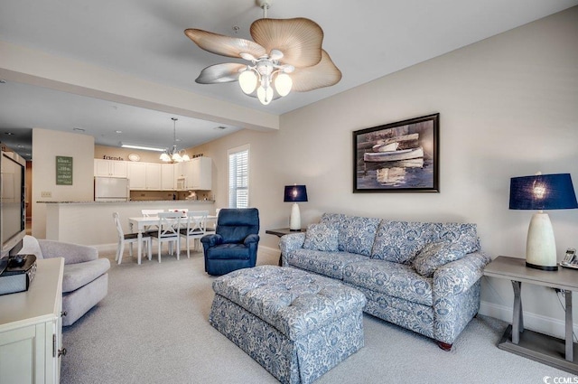 living room with light colored carpet and ceiling fan