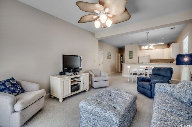 living room featuring ceiling fan with notable chandelier and light carpet