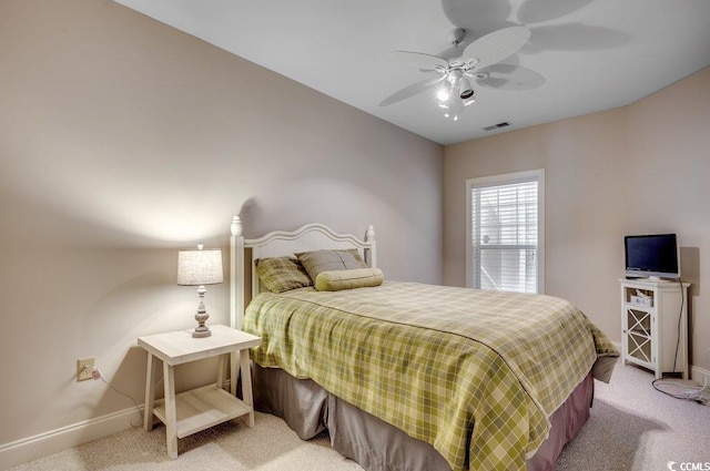 bedroom featuring ceiling fan and carpet