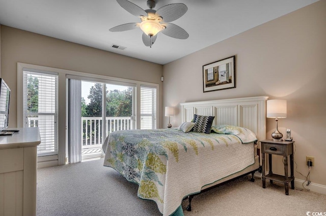 bedroom featuring multiple windows, carpet flooring, access to outside, and ceiling fan