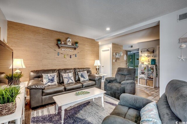 living room featuring a textured ceiling