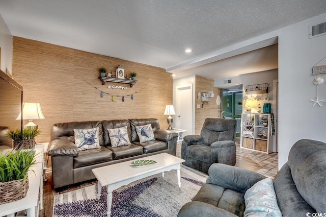 living room with a textured ceiling